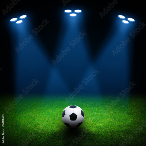 Soccer ball on green stadium © Alekss