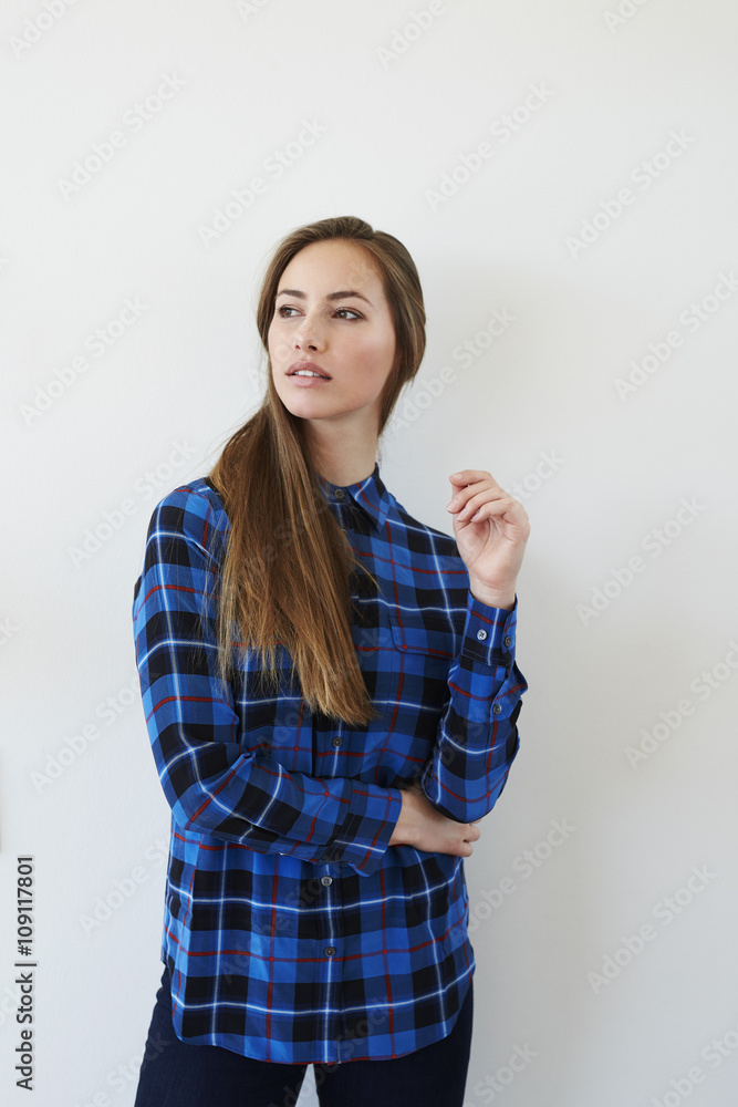 Gorgeous woman in blue checked shirt, looking away Gorgeous woman in blue checked shirt, looking away