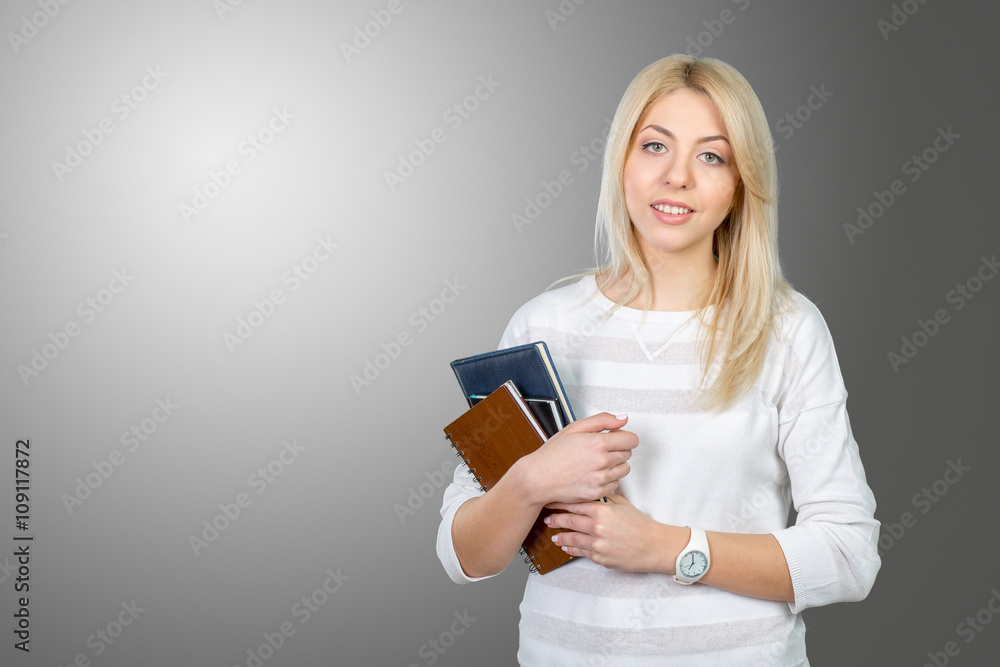Blonde student with stack of books Blonde student with stack of books