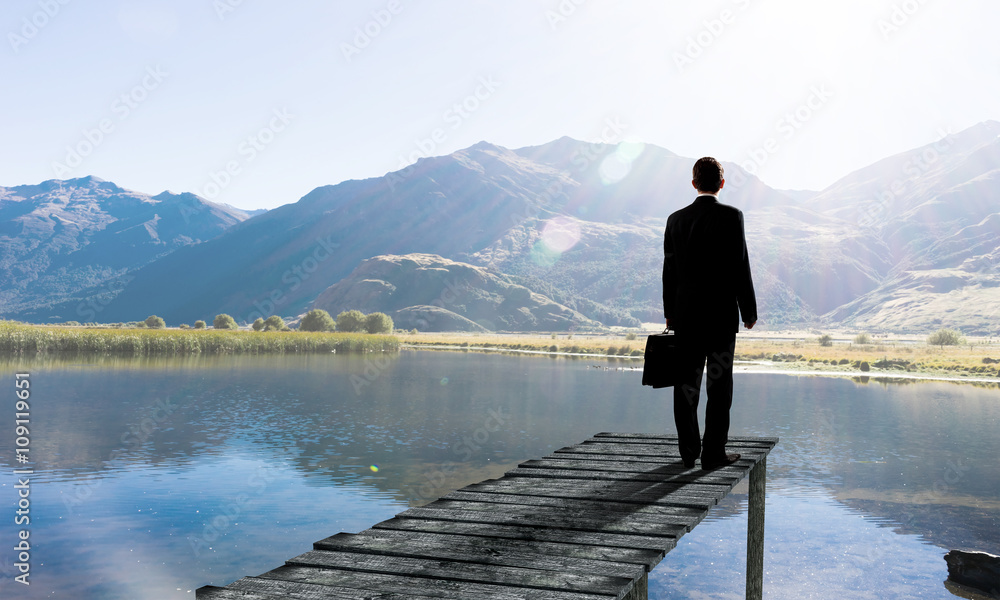 Businessman stand on berth