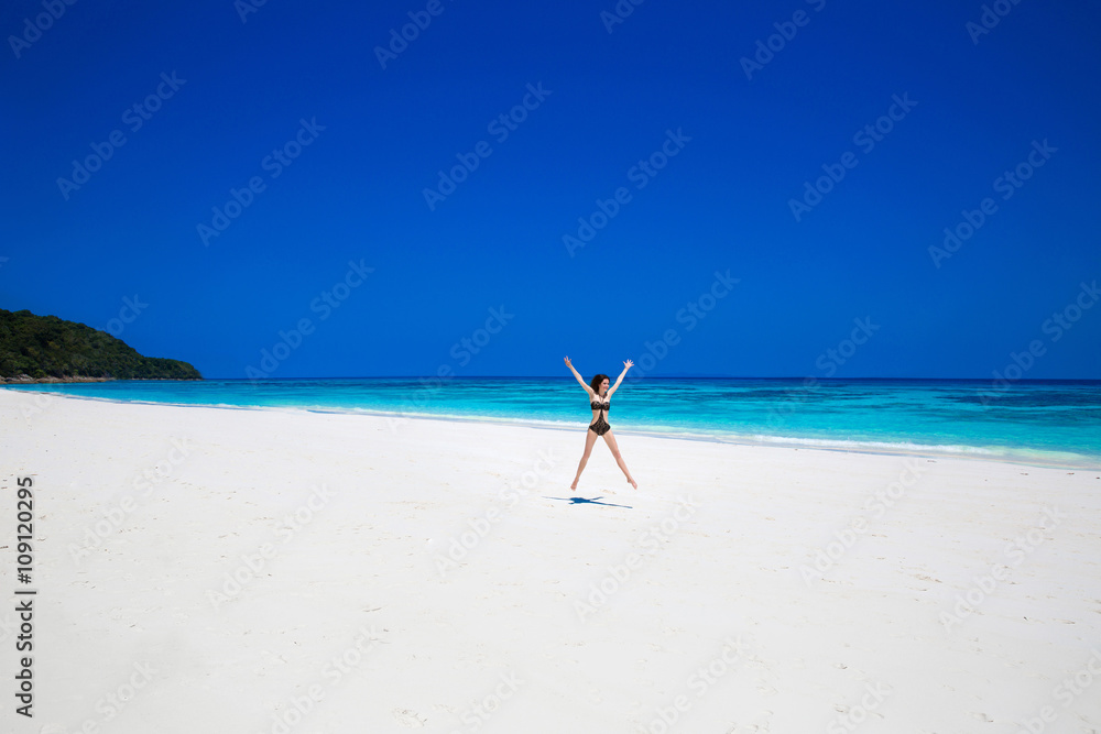 Enjoyment. Seashore. Happy free woman Raising Hands or Open arms Enjoyment. Seashore. Happy free woman Raising Hands or Open arms