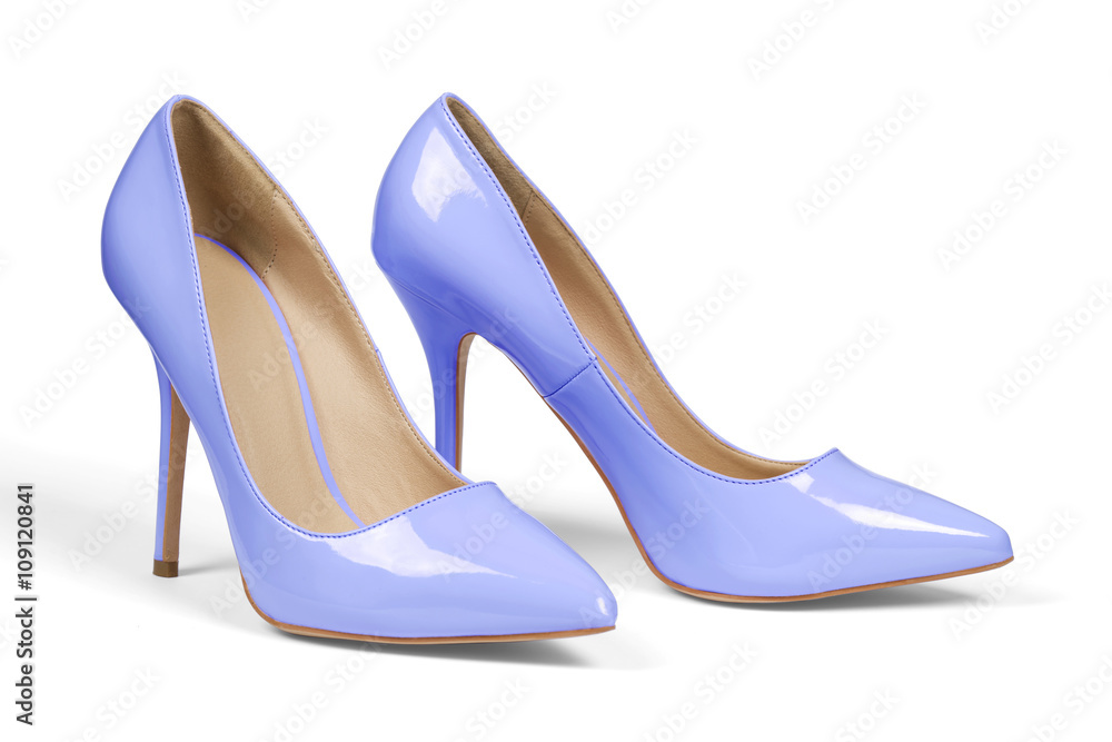 A pair of light blue high heel shoes isolated on white with clipping path. A pair of light blue high heel shoes isolated on white with clipping path.