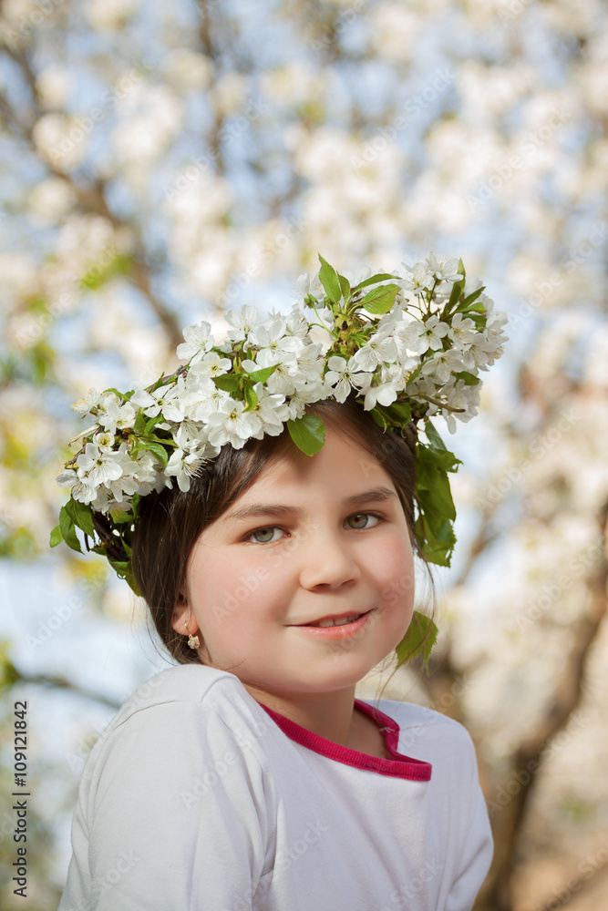 Cute little girl playing on tree in early spring Cute little girl playing on tree in early spring