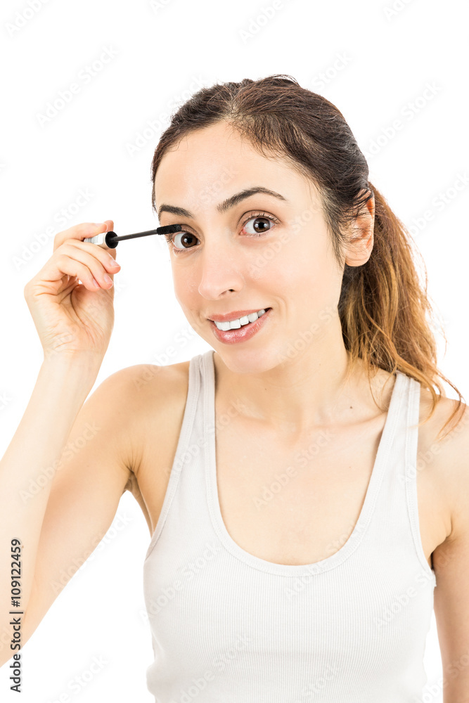 Attractive woman doing make up Attractive woman doing make up