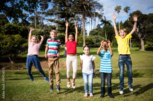 Happy children jumping in the park
