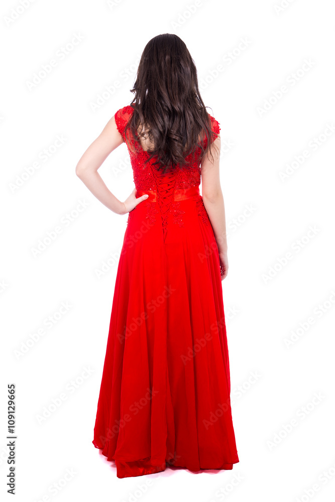 back view of young beautiful woman in red dress isolated on whit
