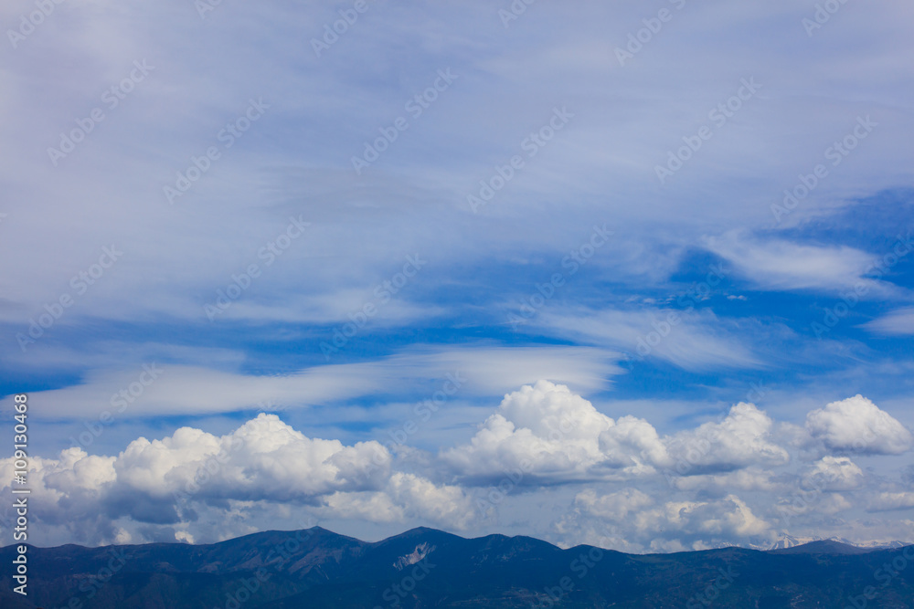 White clouds floating over land