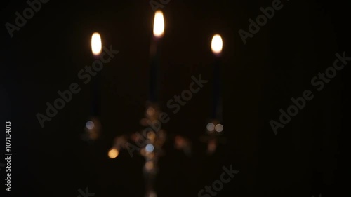 Wallpaper Mural Two glasses of wine clink.Red wine bottle, two wine glasses,burning candles in a chandelier.Wine glasses on the table, a bottle of red wine and burning candles in a beautiful chandelier behind on a Torontodigital.ca