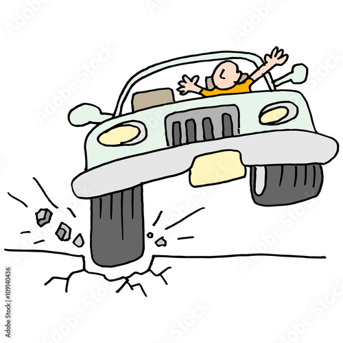 Car hitting a pot hole.