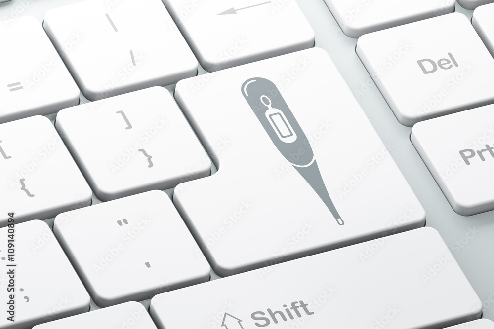 Healthcare concept: Thermometer on computer keyboard background Healthcare concept: Thermometer on computer keyboard background