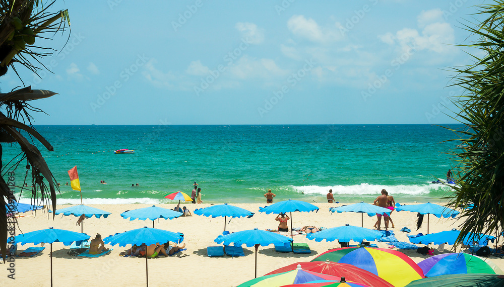 Obraz premium Tourists on Kata beach on a sunny day, Phuket, Thailand 