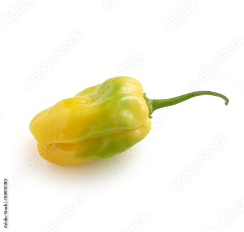 fresh and tasty yellow habanero pepper with green spots cut thro