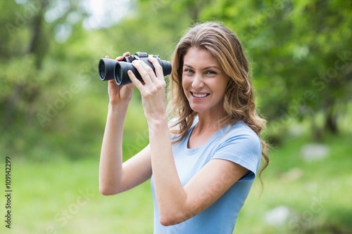 Portrait of young woman with binoculars