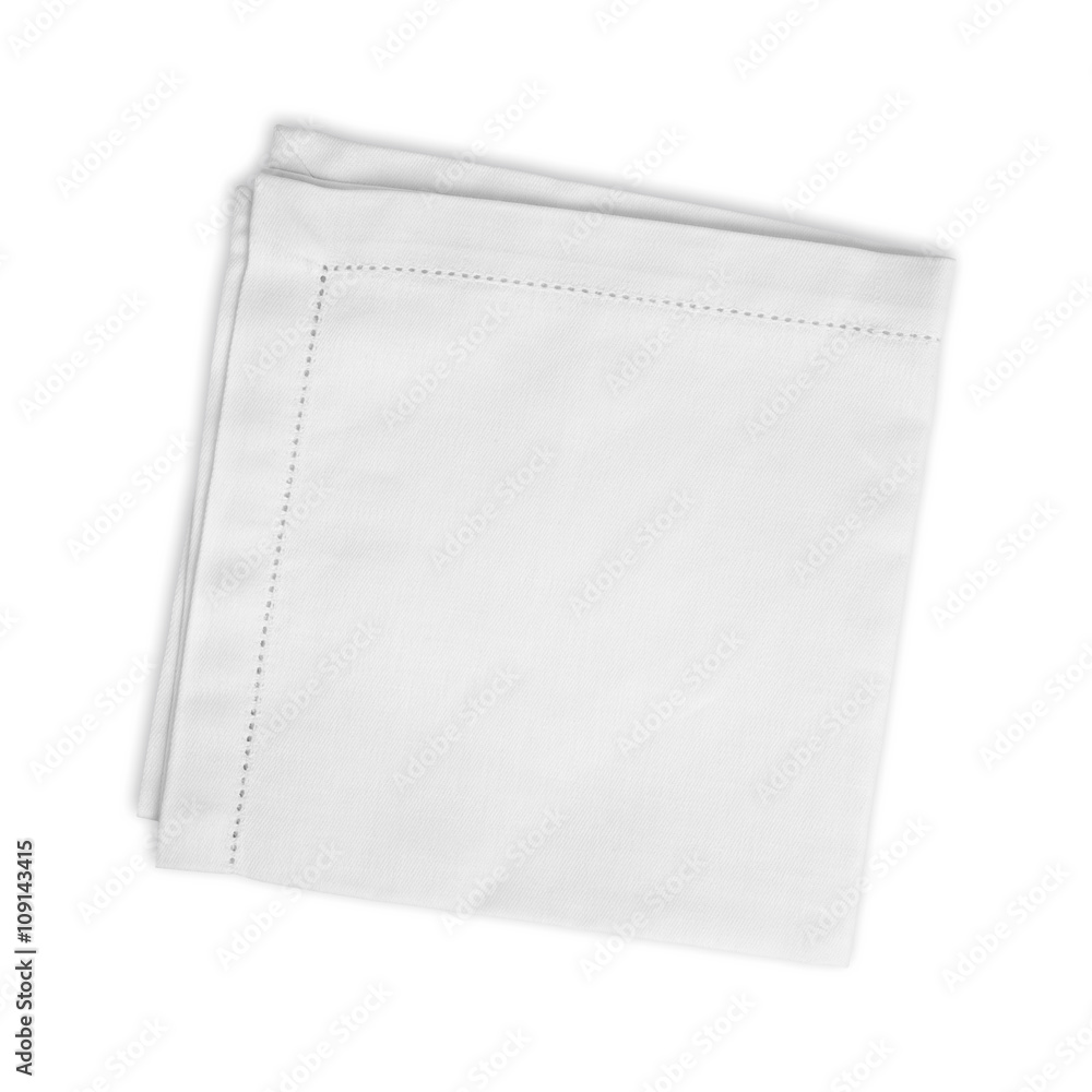White folded linen napkin isolated on white background White folded linen napkin isolated on white background