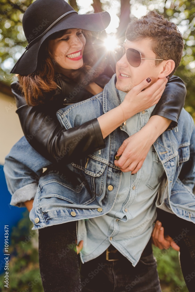 Fototapeta premium Man carrying his girlfriend