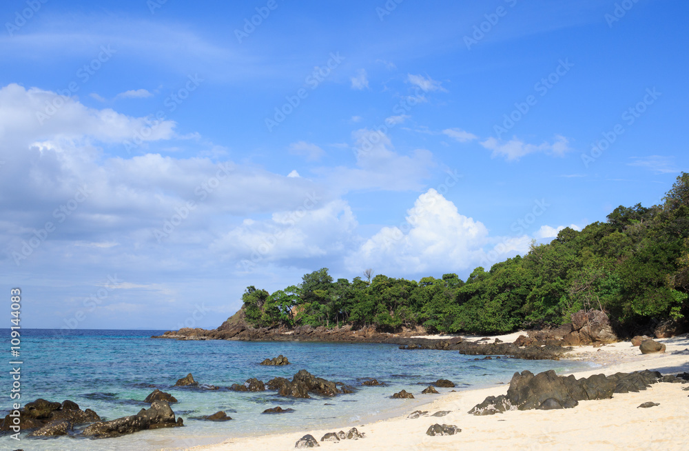 rough rock stone coastal in white bay tropical beach, green island