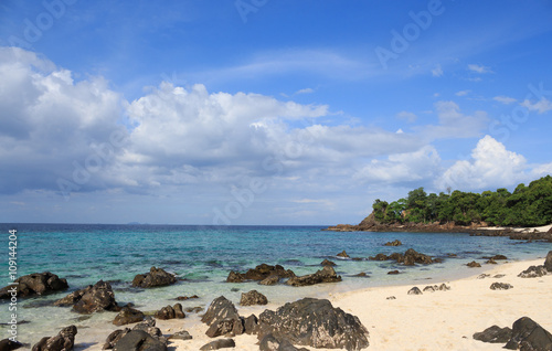 rough rock stone coastal in white bay beach island, blue sea sky