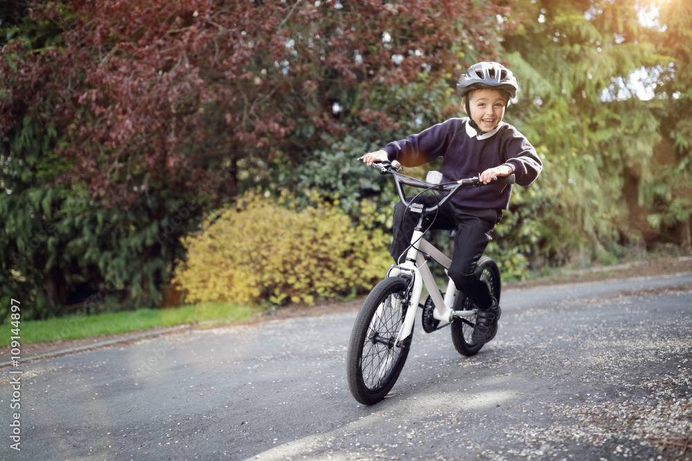 Boy learning to ride his bike Boy learning to ride his bike