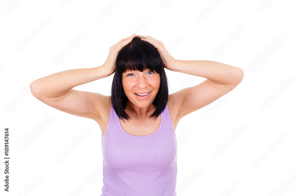 Gesture - Portrait of Mature Woman Has Shocked or Surprised, holding her head both hands. Dressed in t-shirt violet color, isolated over white Gesture - Portrait of Mature Woman Has Shocked or Surprised, holding her head both hands. Dressed in t-shirt violet color, isolated over white