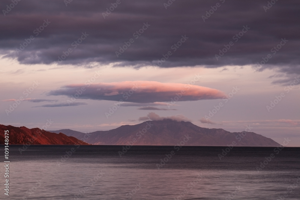 The sea and the distant island. Peninsula Kony. The Sea of Okhotsk. Magadan Region. Russia.