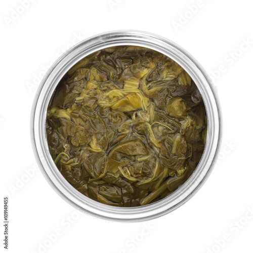 Canned spinach in a can on a white background