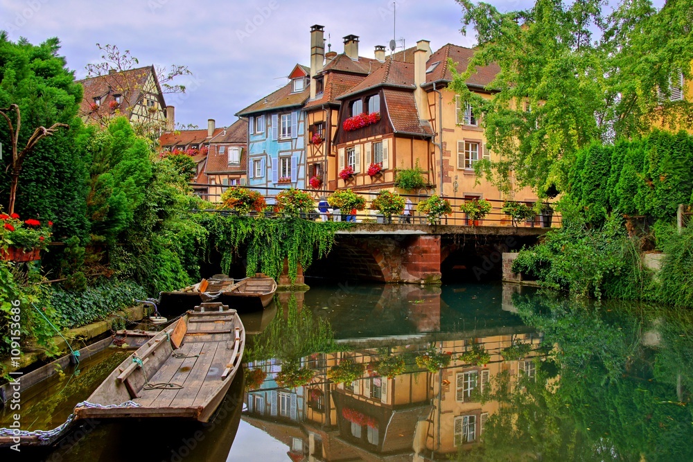 Tranquil canals with reflections in the pretty town of Colmar, Alsace, France