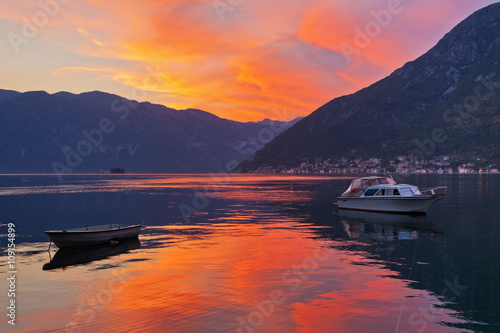  boat in the sea at sunset