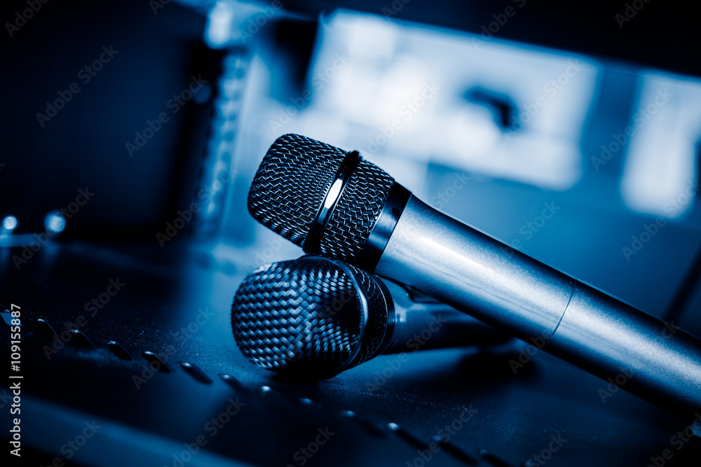 Obraz premium closeup view of microphone,still life,blue toned image.