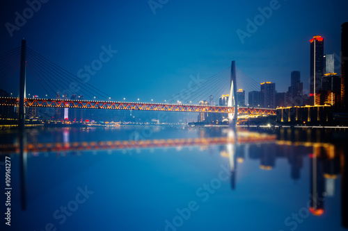 Chongqing China night cityscape at the Jialing River and Qianximen Bridge