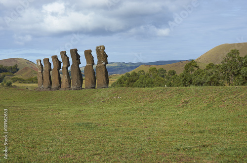 Ahu Kivi. Ancient Moai statues set amongst green fields and facing the sea on Rapa Nui (Easter Island)