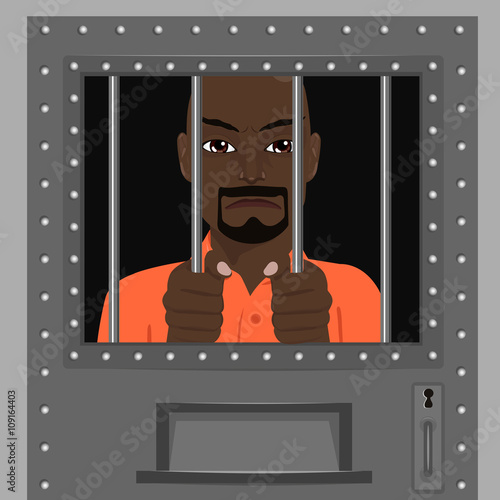 african american man looking from behind bars
