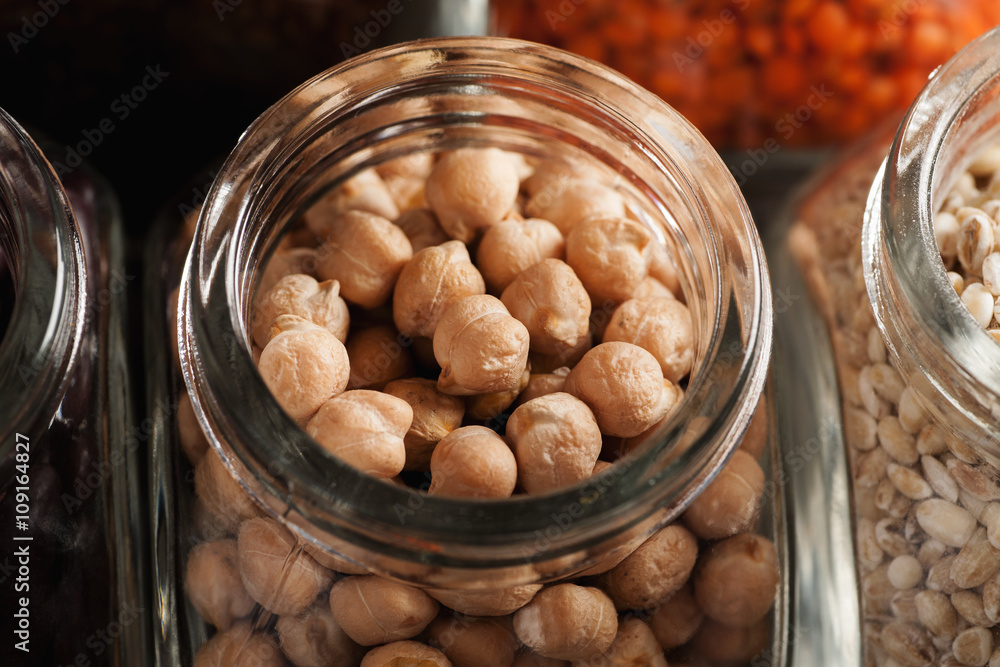 Closeup macro shot of chickpeas in glass jar Closeup macro shot of chickpeas in glass jar