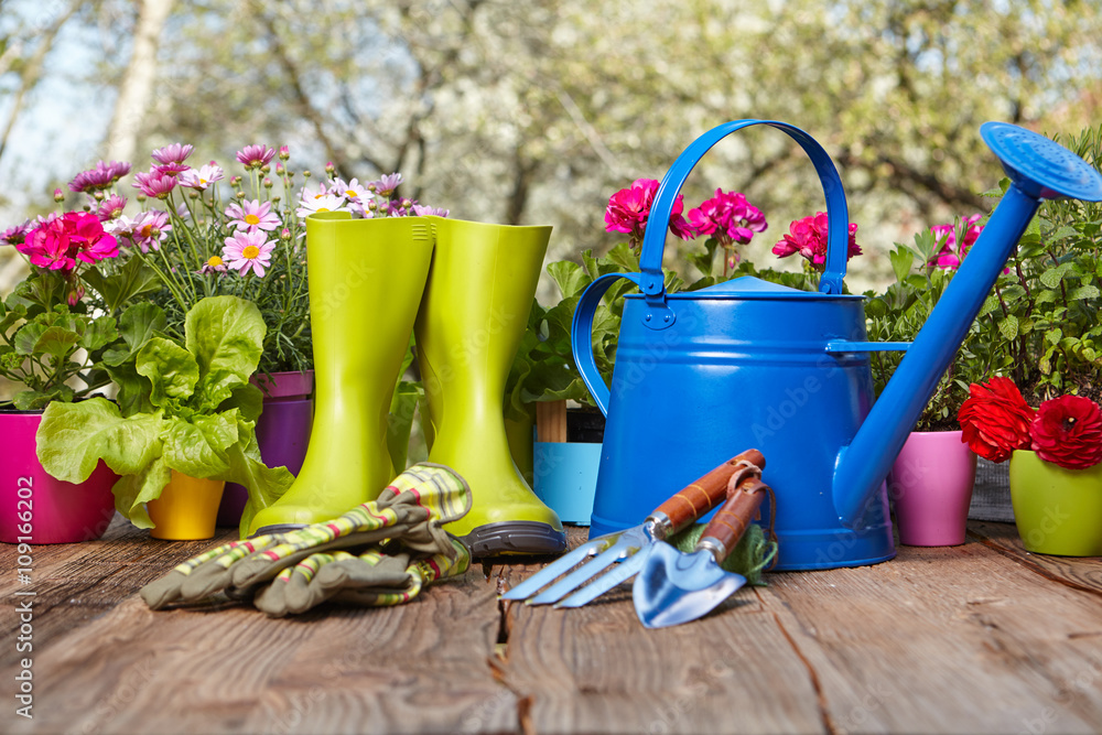 Outdoor gardening tools on old wooden table Outdoor gardening tools on old wooden table