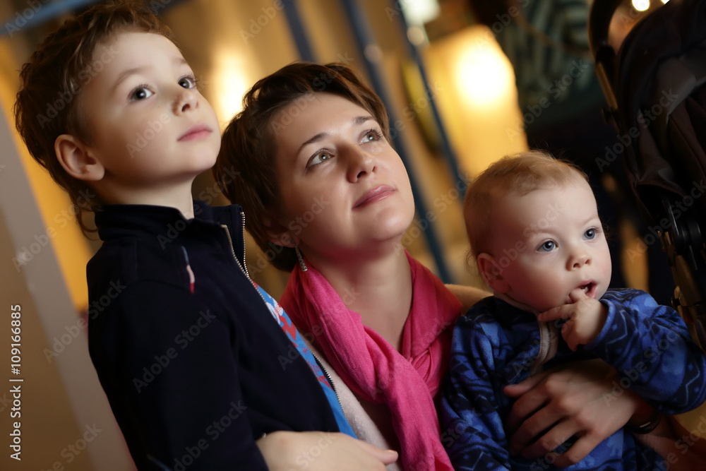 Mother and her sons in museum Mother and her sons in museum