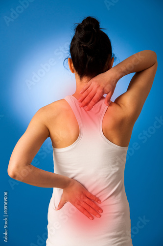 Woman having pain in her back - back injury