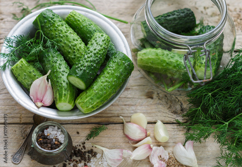 Cucumbers for pickling. Fresh cucumbers ready for canning with dill, garlic and spices. Selective focus 