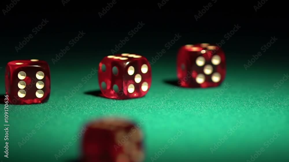 Multiple red dice rolling on green table. Beautiful casino background, gambling Multiple red dice rolling on green table. Beautiful casino background, gambling