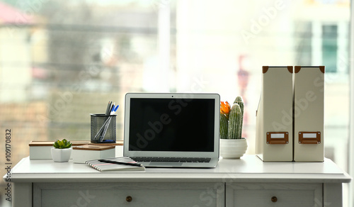 Laptop on the table in the ...