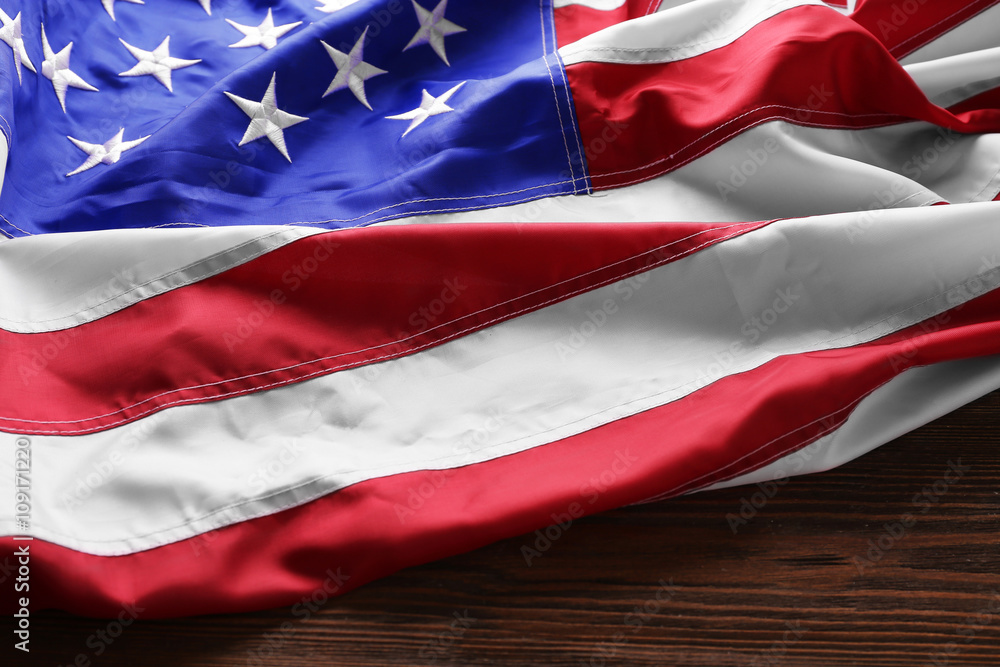 Fototapeta premium USA national flag on wooden background, close up