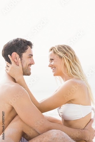 Happy couple sitting and embracing © WavebreakMediaMicro