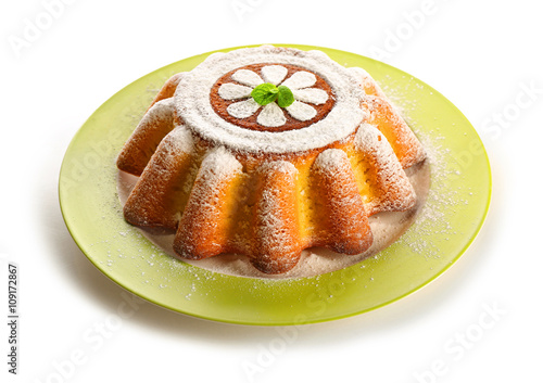 Delicious citrus cake with powdered sugar. on white background