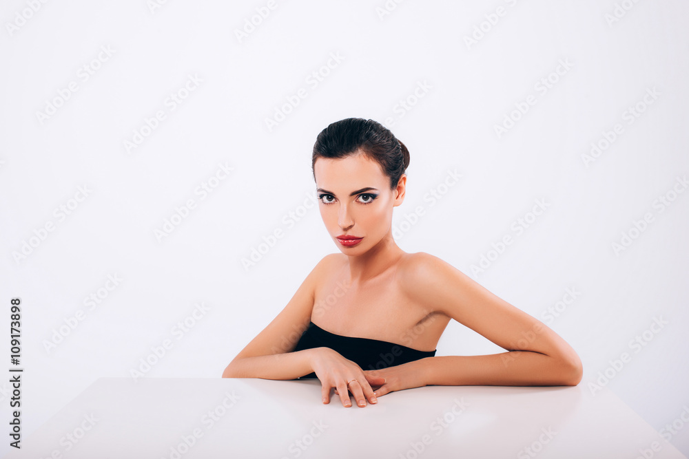 Fototapeta premium Beautiful Skinny Brunette Woman profile portrait. Beauty Luxury Makeup and Black Dress. Gorgeous Fashion Model Girl Portrait Isolated on a white background. 