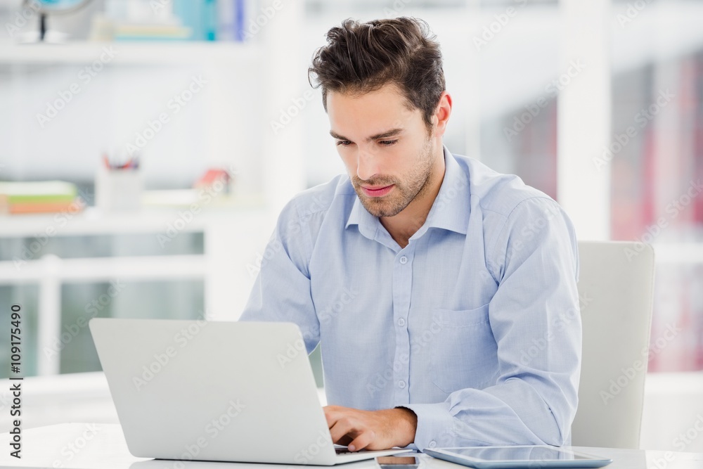 Businessman working on laptop Businessman working on laptop