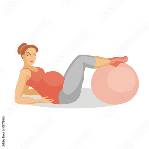 young beautiful future mother does exercises with a fitball lying on a floor