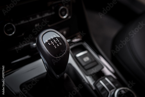 Gearshift handle in modern car black interior
