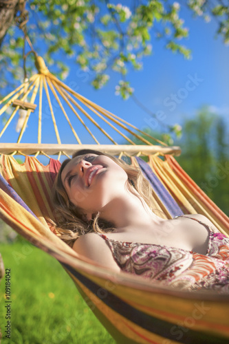 Portrait of Caucasian Blond Lady Resting in Hummock During Spring Time © danmorgan12