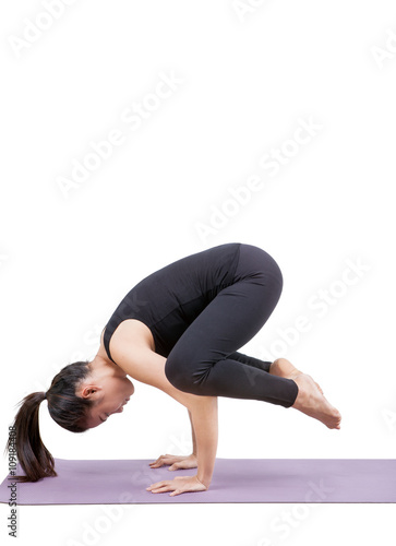 portrait of asian woman wearing black body suit sitting in yoga