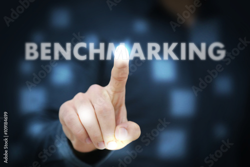 Businessman touching Benchmarking