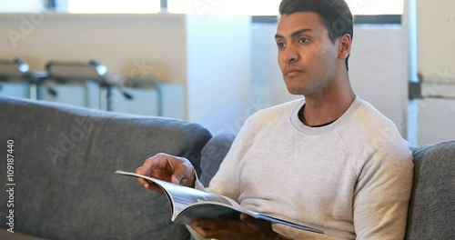 Man reading a magazine in a waiting room