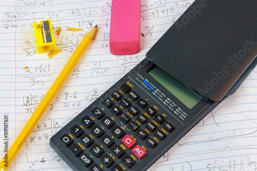 Math Homework Algebra:
A macro picture of Math College Algebra homework paper and math accessories.